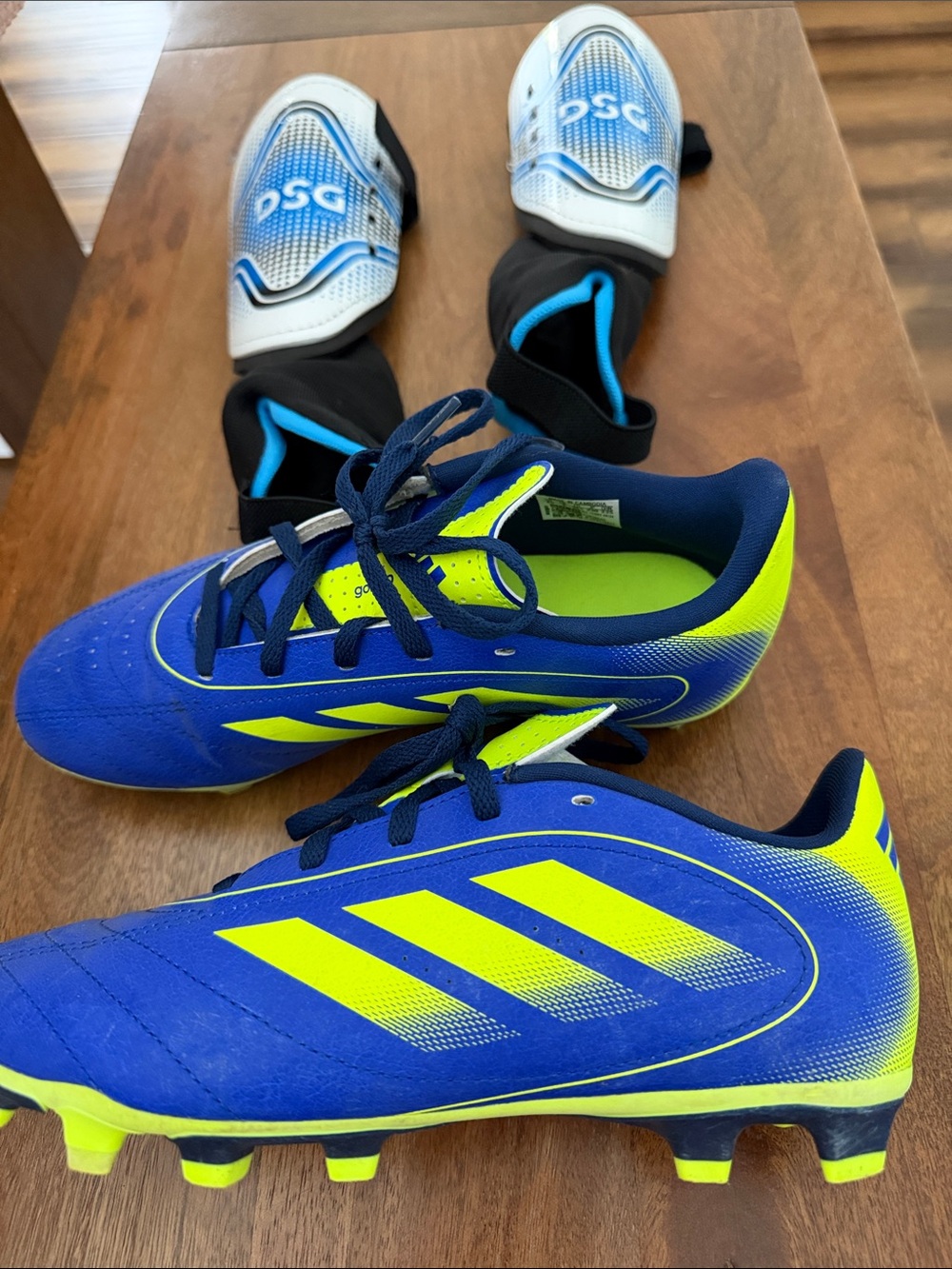 adidas Kids Blue and Neon Yellow Soccer Cleats and DSG kids shin guards size L